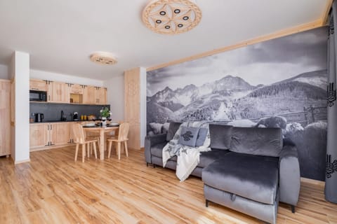 Relax in the stylish living room with a comfortable sofa and atmospheric decor.