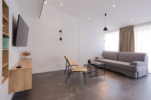 Luxury Apartment | Living area | 55-inch Smart TV with satellite channels, TV, heated floors