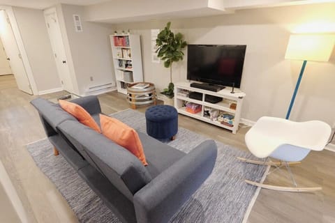Open living room with space complete with kids toys, perfect for your family's stay!
