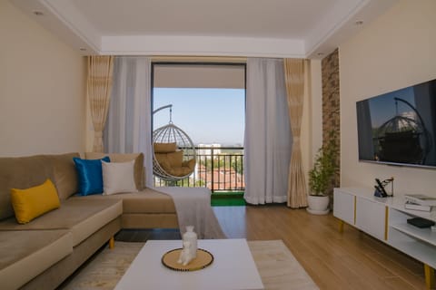 Executive Apartment | Living area | 42-inch flat-screen TV with digital channels, TV