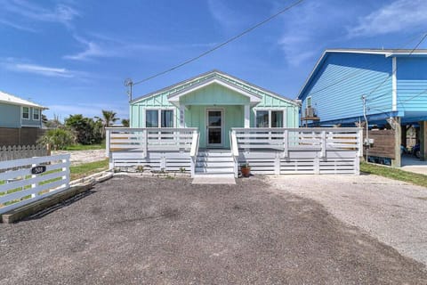 Front view of the home with private parking and gated entry.