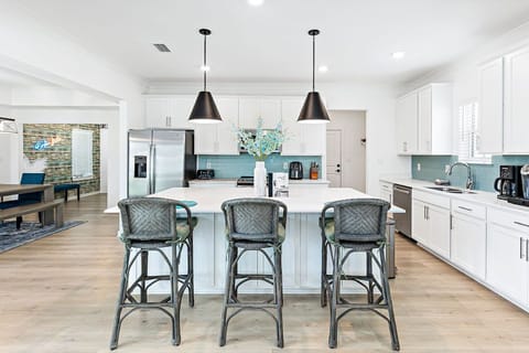 Open Kitchen Design with Large 3-Seat Island Makes It the Hub for Activities