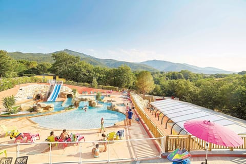 Large water park area surrounded by nature, offering endless activities for guests.