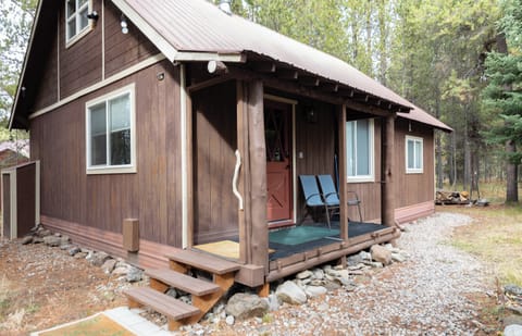 Welcome to the Bear Den with a covered front porch.