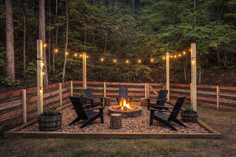 Outdoor firepit is located inside the fenced in backyard. Firewood can be purchased at any nearby convenience store, hardware store, and most grocery stores.
