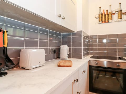 Fridge, electric kettle, toaster, cookware/dishes/utensils