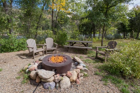 Gas firepit with seating on the Animas River