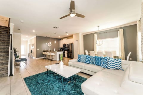 Experience luxury in this open-plan living space with modern kitchen, chic dining area, and cozy lounge perfect for gatherings.