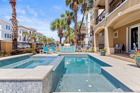 Your private oasis awaits with crystal-clear pool waters reflecting swaying palms, while turquoise loungers invite you to soak up the sunshine.
