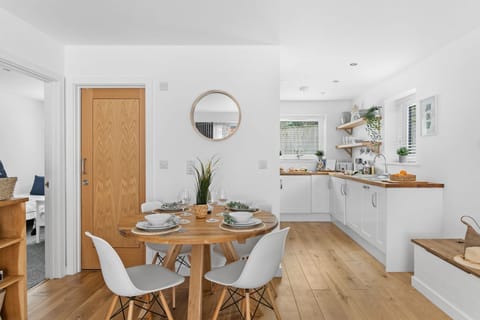 Round dining table next to the kitchen - Plover 1, The Cove