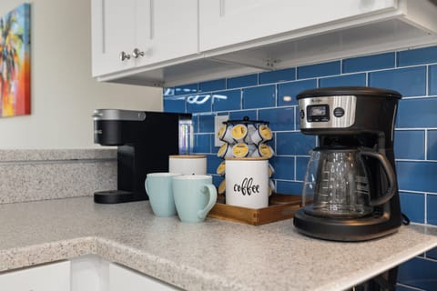 Fully stocked custom kitchen open to the living room.