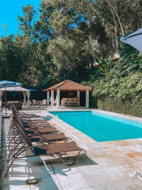 Outdoor pool, open 11:00 AM to 8 PM, pool umbrellas, sun loungers