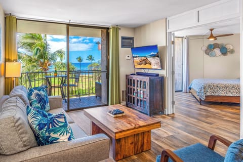 Deluxe Condo | Living area | 55-inch Smart TV with cable channels, TV, Netflix