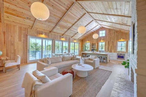 Cozy seating area perfect for lounging, surrounded by large windows for natural light.