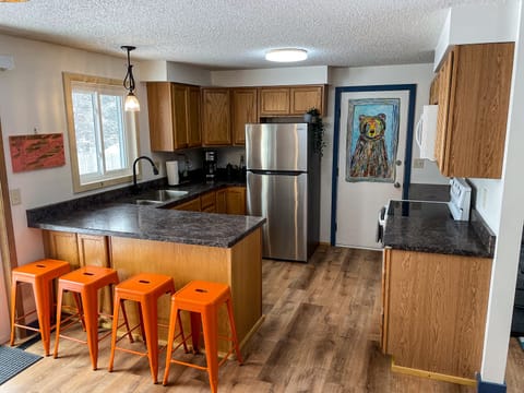 The kitchen includes pots, pans and other cooking essentials