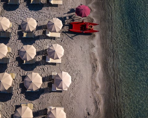 Beach nearby, white sand, sun loungers, beach umbrellas