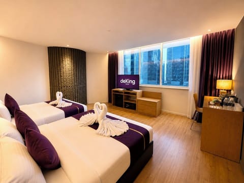 Deluxe Family - City View | Minibar, in-room safe, desk, laptop workspace
