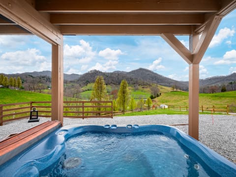 Relax in the hot tub while enjoying the incredible panoramic mountain views.