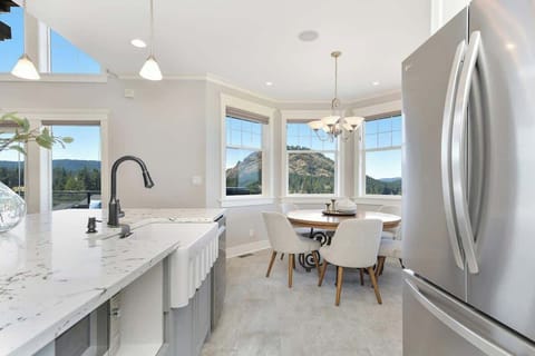 Fully equipped modern kitchen with amazing views on the main floor.