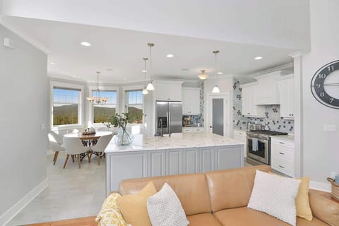 Fully equipped modern kitchen with amazing views on the main floor.
