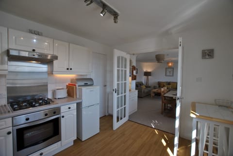 The kitchen opens up to the dining area and lounge
