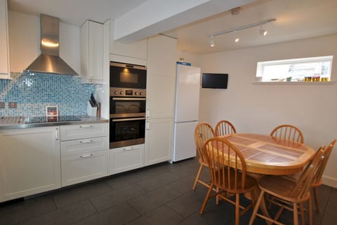 The dining kitchen is fully fitted