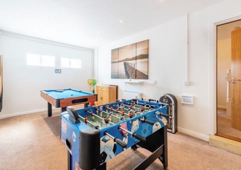 The garage has been converted into a spacious games room