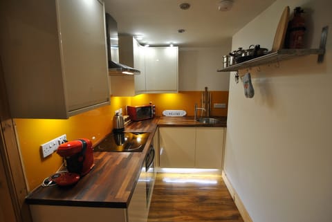 The kitchen is centrally positioned in the apartment