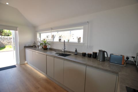 French doors in the kitchen connect you with the garden