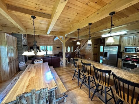 Dinning room supplemented with more chairs and eating spacing on the kitchen counter top. Enjoy a wide open area when you family and guests can all see one another.