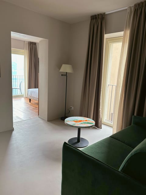 Superior Suite, Balcony, Lake View | Hypo-allergenic bedding, down comforters, minibar, in-room safe