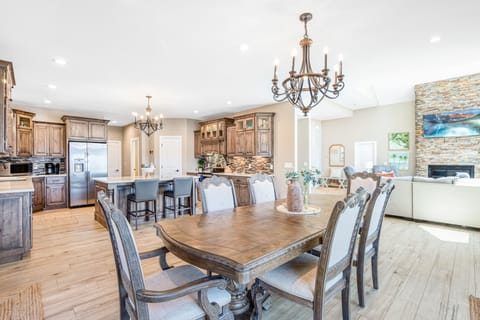 Open living and dining room connect with custom kitchen for dining in