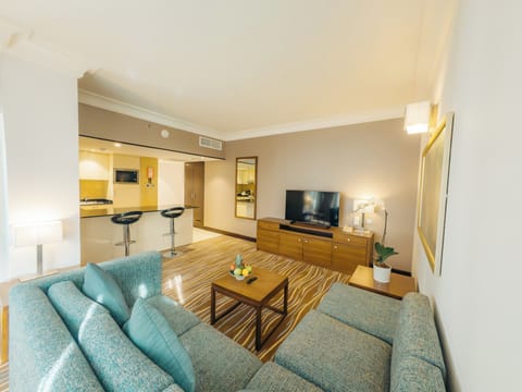 Business Suite | Living area | 28-inch LCD TV with satellite channels