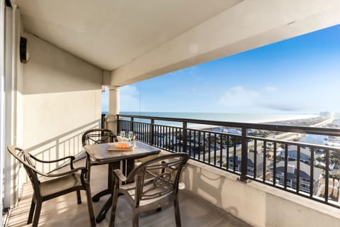 Enjoy morning coffee on your private balcony while soaking in sweeping city views that stretch to distant mountains.