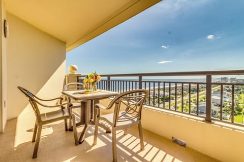Sip your morning coffee on your private balcony while taking in sweeping city views and gentle sunlight streaming across the outdoor dining space.
