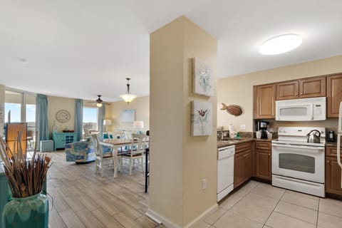 Your spacious open-concept home features a fully equipped kitchen flowing seamlessly into the dining and living areas, perfect for gathering together.
