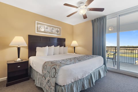 Wake up to peaceful golf course views from your comfortable king bed with plush linens and private balcony access.