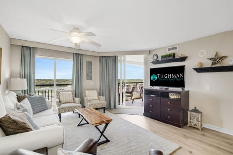 Relax in your bright, airy living room with stylish coastal decor and step out onto your private balcony for stunning views.