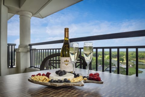 Savor wine and cheese on your private balcony with sweeping views over lush landscapes and sparkling waters below.