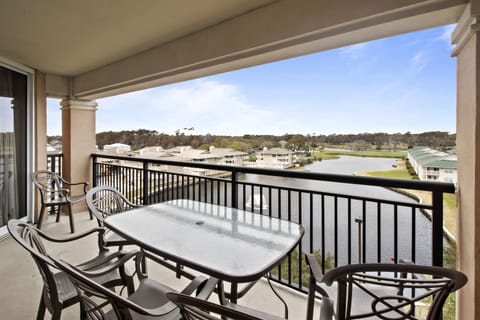 Your private balcony offers stunning golf course views where you can enjoy morning coffee or evening meals while overlooking the peaceful landscape.
