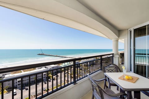 Your private balcony offers stunning sea views where you can sip morning coffee while watching waves roll onto the sandy shore below.
