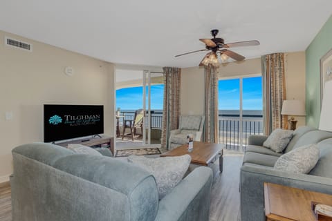 Unwind in your spacious oceanfront living room where plush seating and panoramic sea views create the perfect backdrop for relaxation.