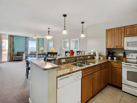 Cook your favorite meals in this fully equipped kitchen with granite counters, then gather at the breakfast bar for cozy conversations.
