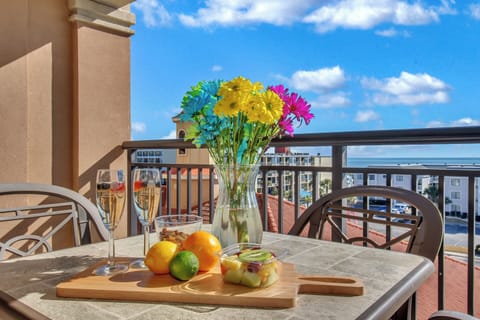 Sip champagne and savor fresh fruit on your private balcony while soaking in panoramic city views and ocean glimpses.