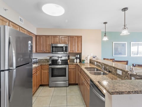 Your fully equipped kitchen awaits with granite countertops, stainless steel appliances, and an open layout perfect for cooking vacation meals.