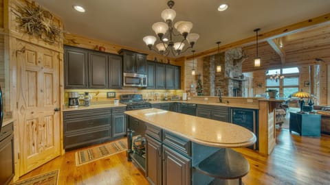 Spacious kitchen with bar stool seating.