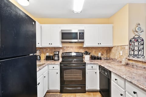 Kitchen area with breakfast bar.