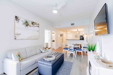 Sun-filled coastal living room with full kitchen, steps from the white sands of Madeira Beach.