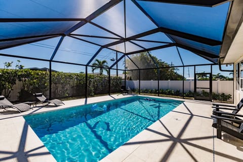 Brand New Pool February 2023 along with cage, big privacy fence, and updated Garden.