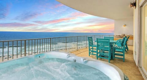 Best seat in Orange Beach.  Enjoy some ultimate relaxation in the hot tub while taking in the breath taking views. 